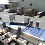 Two lanes of product to single file discharge